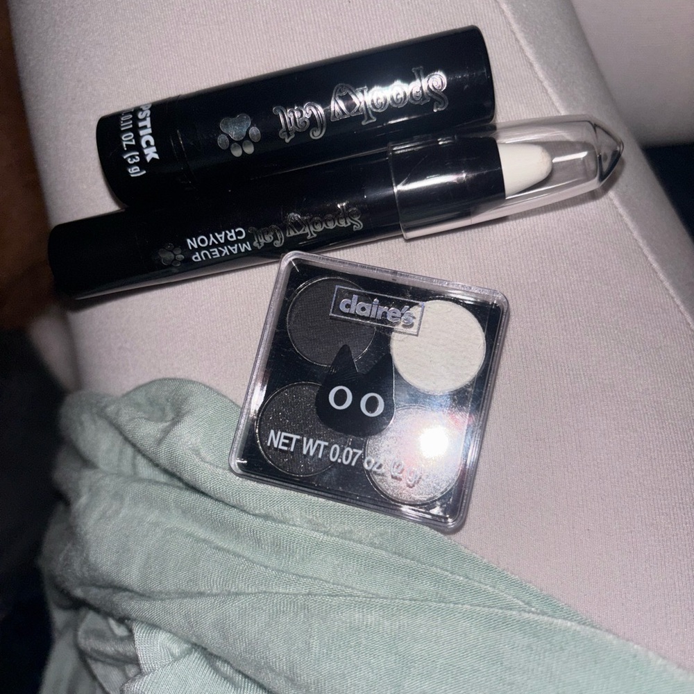 Claire's Black & White Eyeshadow Duo with White Makeup Crayon and lipstick